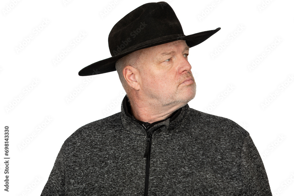 Serious Middle-Aged Caucasian Man in Worn Cowboy Hat looking to the Side - Isolated Portrait on White Background Serious Middle-Aged Caucasian Man in Worn Cowboy Hat looking to the Side - Isolated Portrait on White Background