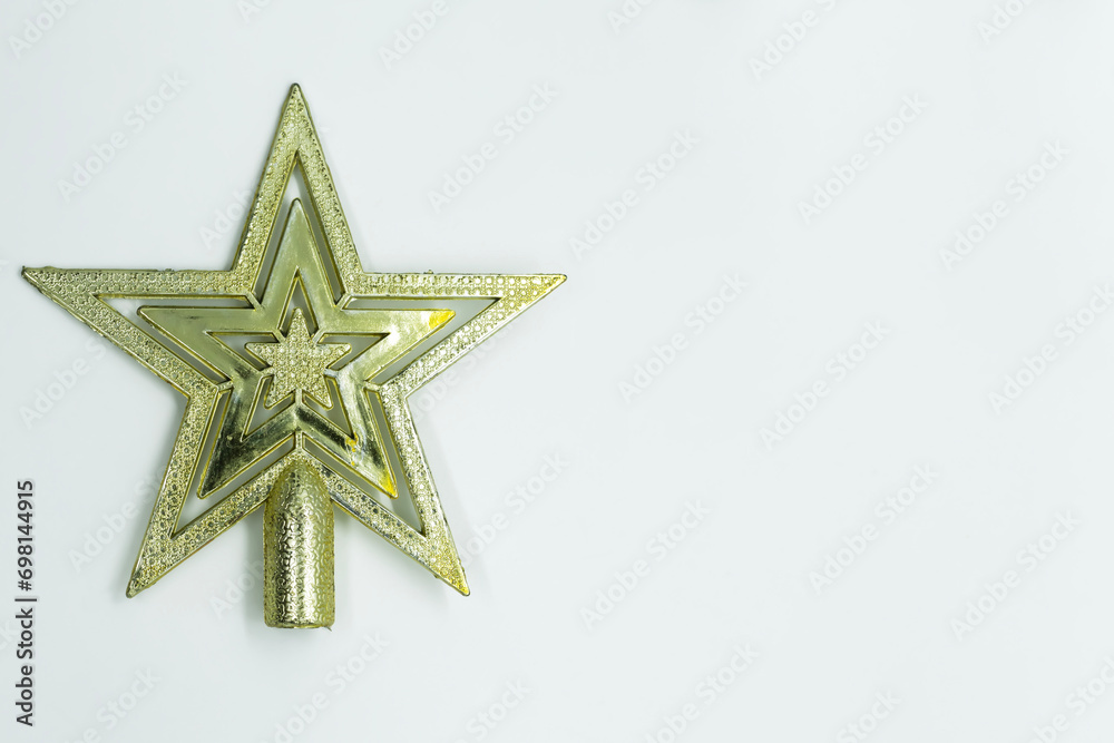 Christmas star decoration on white background. Top view with copy space for text. Christmas star decoration on white background. Top view with copy space for text.