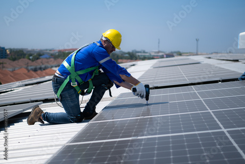 Wallpaper Mural Both of technicians is installing solar panels on the roof of the warehouse to change solar energy into electrical energy for use in factories. Torontodigital.ca