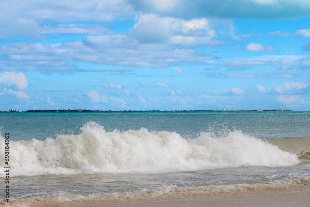 Caribbean Sea waves and Isla Mujeres in the background