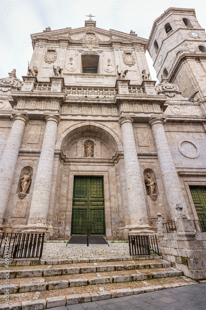 Main facade of Valladolid Cathedral with a huge wooden door, Castilla LEon.