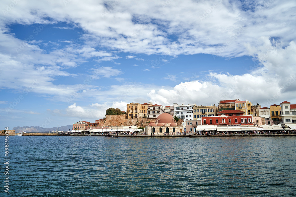 Taverns, historic buildings and crowds of tourists in the port of Chania on the island of Crete