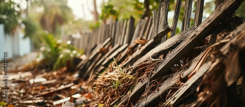 Debris from hurricane caught in fence.