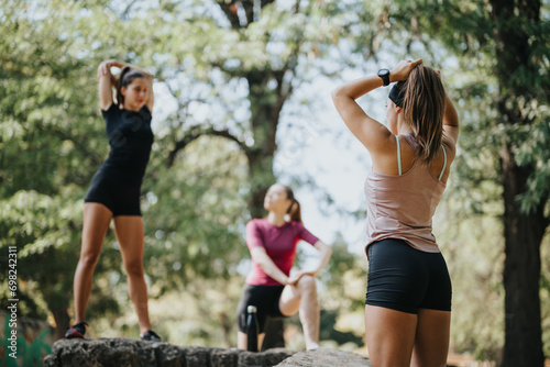 Active females enjoy outdoor sports and training together in a city park on a sunny day  engaging in fitness and flexibility activities.