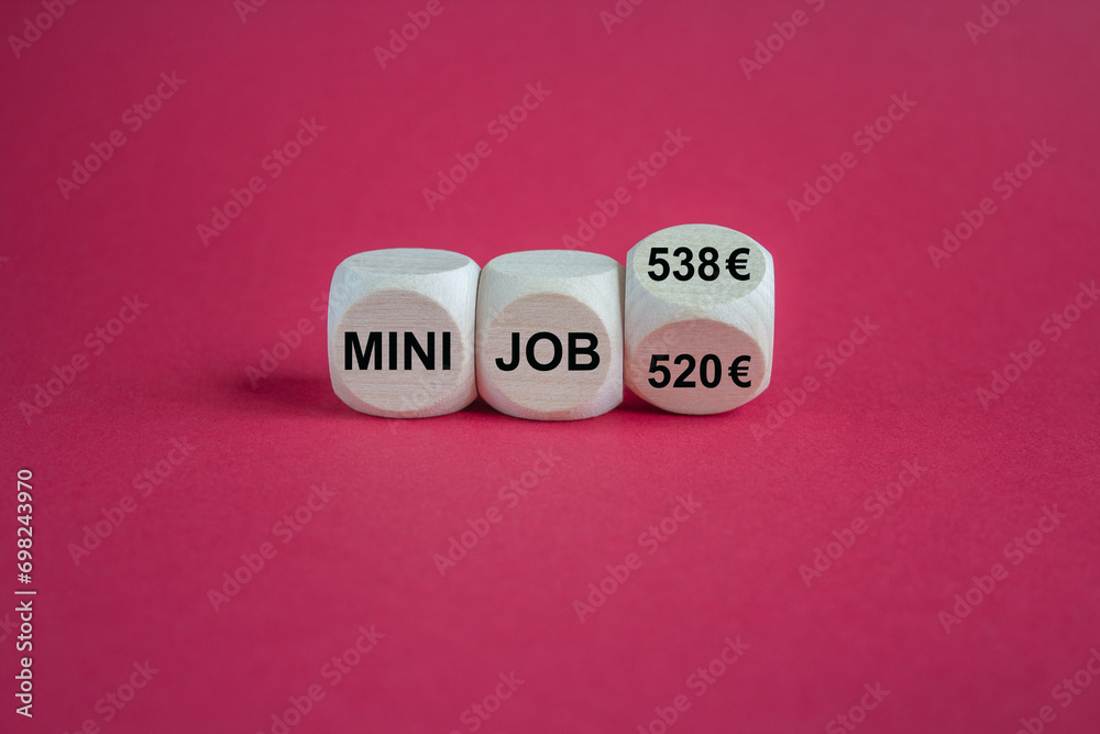 Symbol for the raise of the income limit for tax free minijobs in Germany from 520 Euro to 538 Euro in 2024. Beautiful red background, copy space.