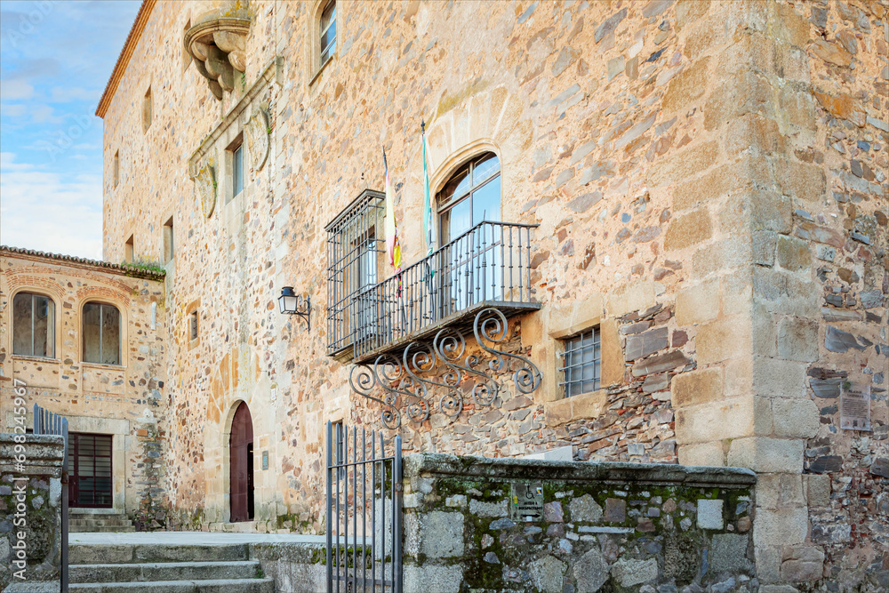 Ancient spanish building with wrought iron balcony