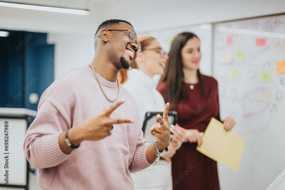 Happy business professionals collaborate, strategize, and innovate in a modern office. They analyze data, generate ideas, and work towards profitability.