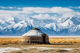 Yurt nomad house stands in the Asian steppe with mountains background