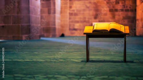  Islamic background photo. Overhead view of the Holy Quran placed in a mosque. photo