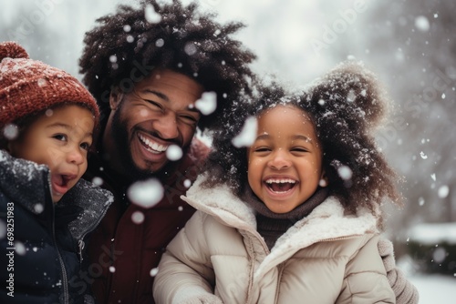 Portrait of a happy family having fun outside in snow
