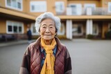 Portrait of a smiling elderly woman outdoors