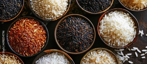 Different rice types and colors in bowls, seen from above. photo