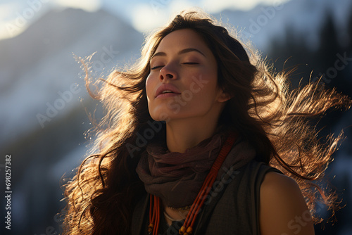 Eyes closed woman breathes deeply inhaling crisp air of mountain summit embodying sense of clarity and elevation Girl meditating photo