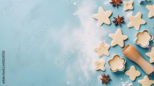  a cookie cutter sitting on top of a table next to cookies and star anisette shaped cookie cutters. photo