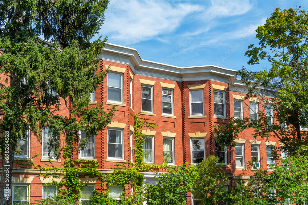 Red brick classic style row houses in a summer day, Brighton, MA, USA