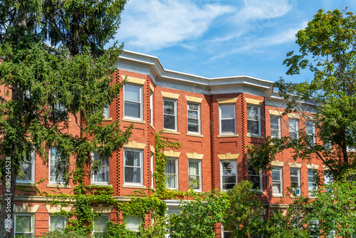 Red brick classic style row houses in a summer day, Brighton, MA, USA photo
