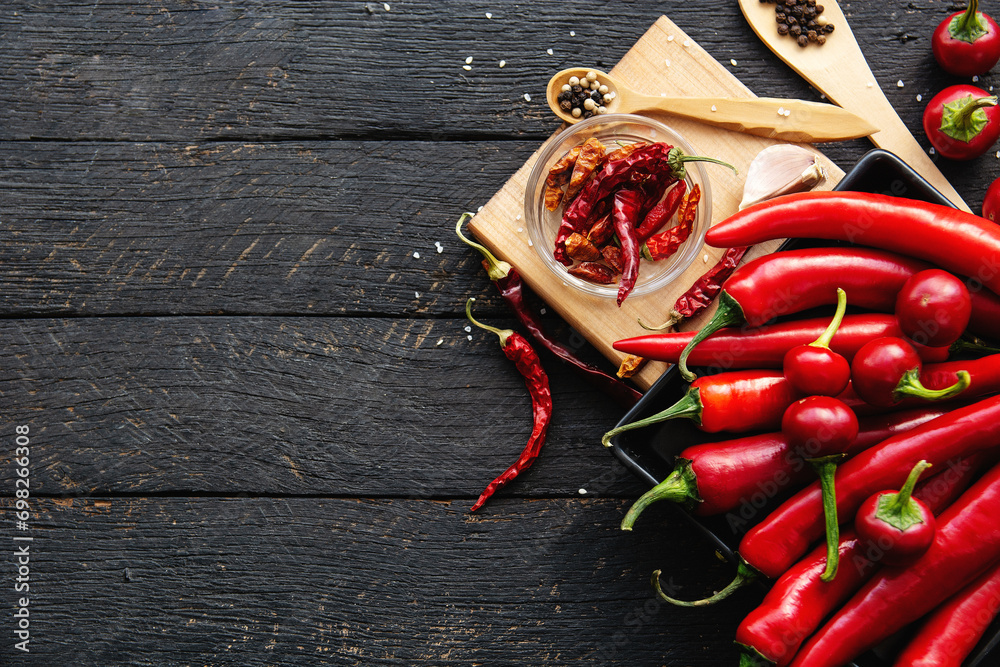 Red hot chili pepper composition, spicy organic paprika background - obrazy, fototapety, plakaty 