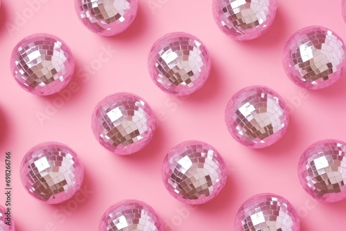 Pattern of small disco balls on simple pink background. 80s or 90s party, Valentine's Day celebration. Retro aesthetics. 3D illustration. Flat lay photo