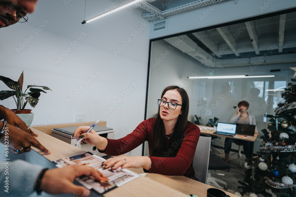 A receptionist welcomes hotel guests at the check-in desk. Customers pay and provide a pin-code for payment.