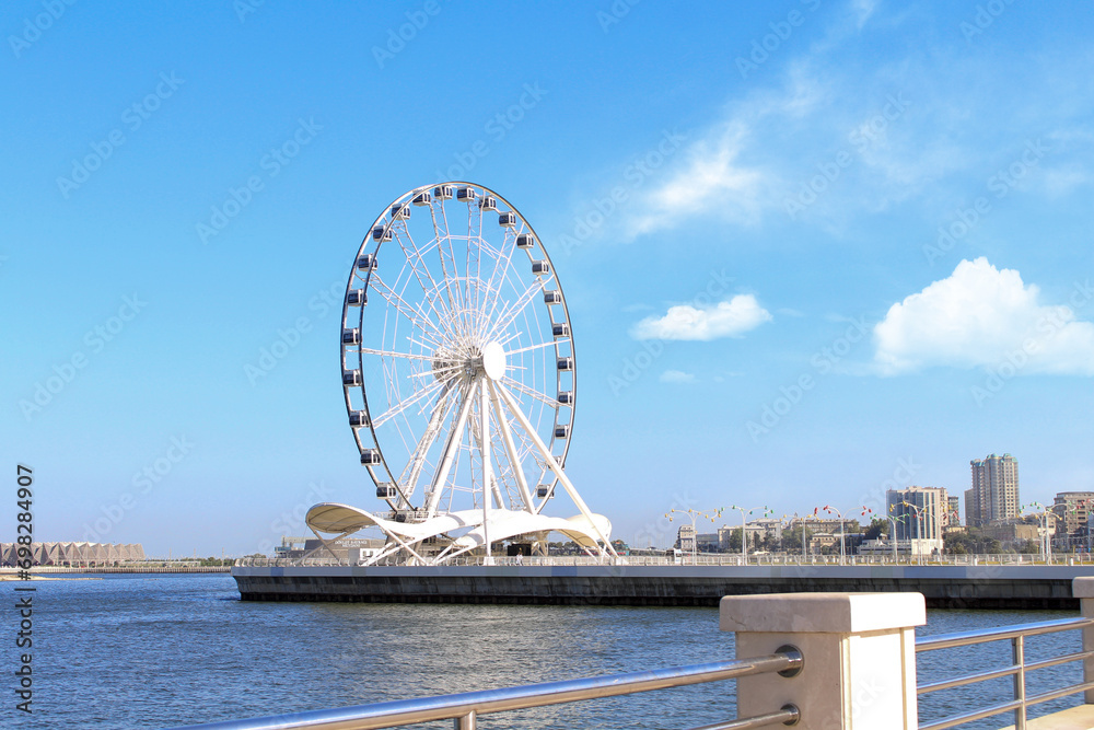Ferris wheel in front of sky. Big carousel in Baku, Azerbaijan