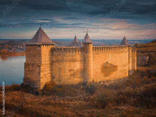 view to facade of fortress in warm sun light in autumn evening