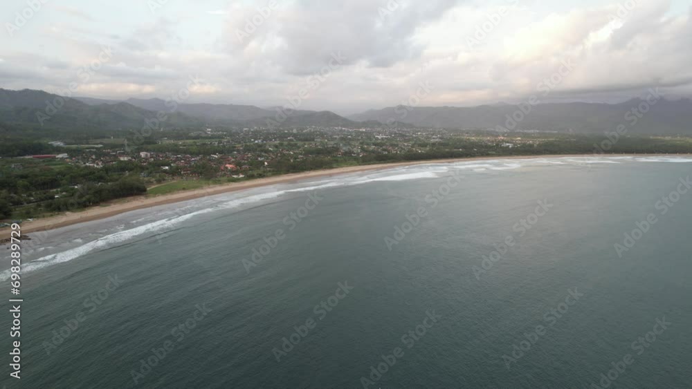 Seascape sand beach with turquoise water, Pacitan. Seascape, ocean and beautiful beach in Pacitan Java Indonesia Seascape sand beach with turquoise water, Pacitan. Seascape, ocean and beautiful beach in Pacitan Java Indonesia