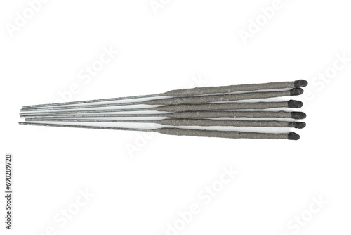 Top view of unlit sparklers on a white background.