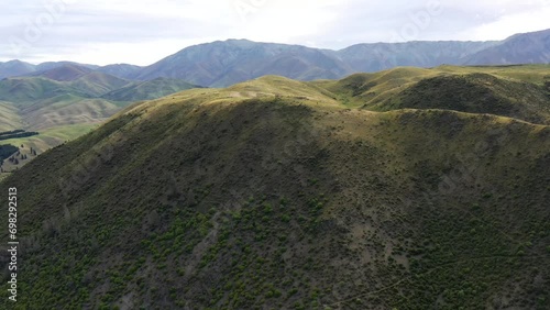 Hill top of scenic mountains at Kurow town in Waitaki valley of New Zealand as 4k.
 photo