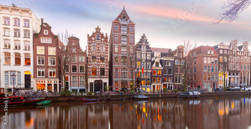 Amsterdam canal Herengracht with typical dutch houses at sunset, Holland, Netherlands. photo