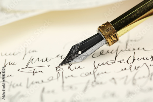 One fountain pen on handwritten letter, closeup