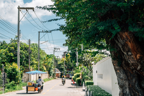 Obraz na płótnie Street food cart bike and green tree road in Chiang Mai, Thailand w salonie
