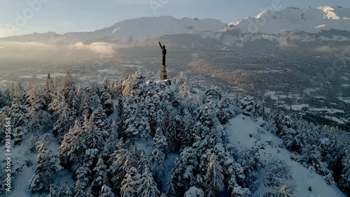 Panoramic Winter View Of Christ The King Statue In Canton of Valais During Winter In Lens, Switzerland. photo