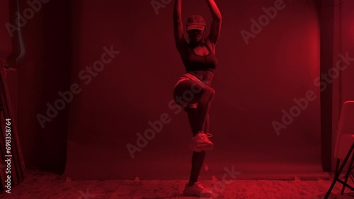 Solo dance under red lights	