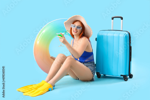 Female tourist with suitcas...