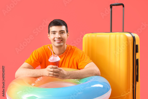 Male tourist with suitcase,...
