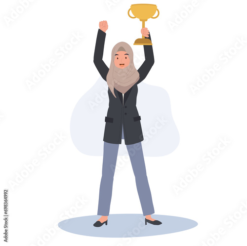 Muslim Businesswoman Celebrating Success with Trophy in Hand