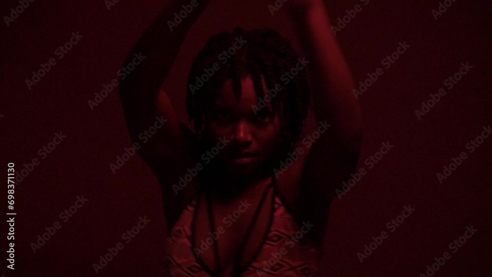 Slow motion of passionate powerful black woman dancing at studio