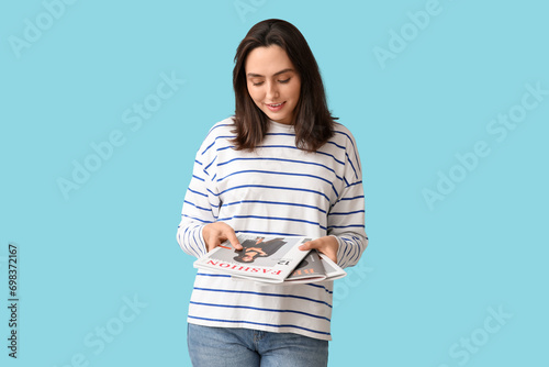 Young woman with magazines ...