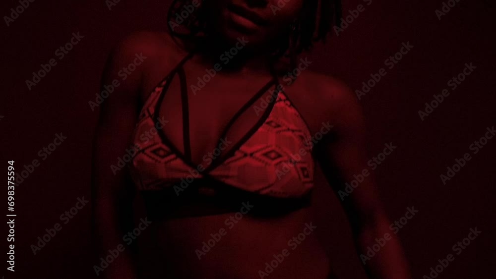 Slow motion of passionate powerful black woman dancing at studio