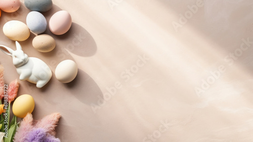 A serene Easter composition with a ceramic bunny, assorted pastel eggs, and soft textures on a smooth, neutral background.
