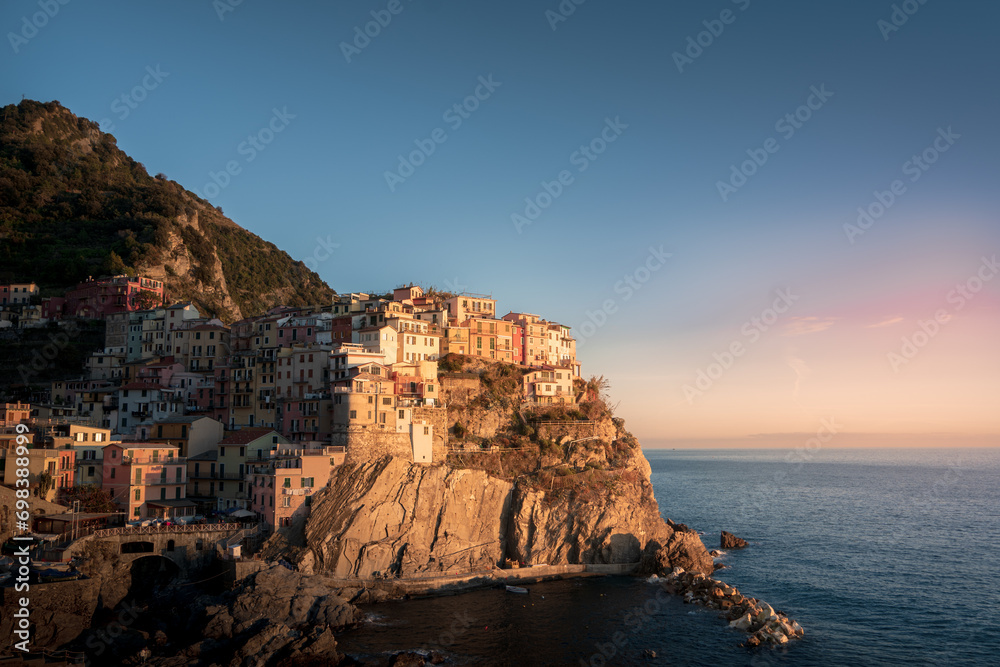 Picturesque village situated atop a cliff, overlooking the  expanse of the seas and oceans below