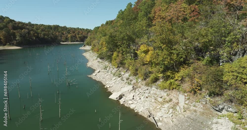 Eagle Hollow Cave Pristine Lake With Wooden Pilings In Arkansas, USA. Eagle Hollow Cave Pristine Lake With Wooden Pilings In Arkansas, USA.