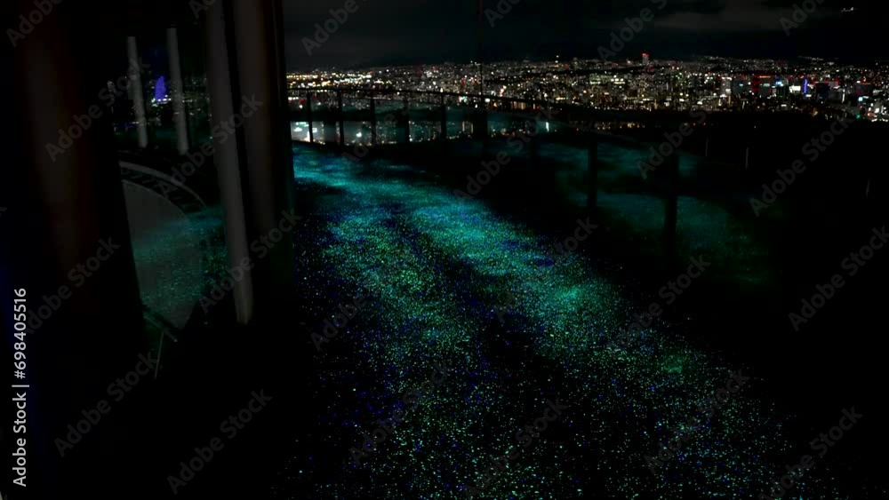 Illuminated LED Path On Top Of Building Overlooking Osaka City Skyline At Night Illuminated LED Path On Top Of Building Overlooking Osaka City Skyline At Night