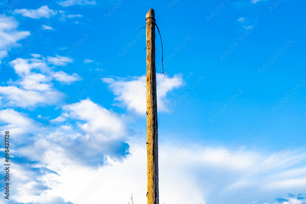 Power electric pole with line wire on colored background close up Power electric pole with line wire on colored background close up