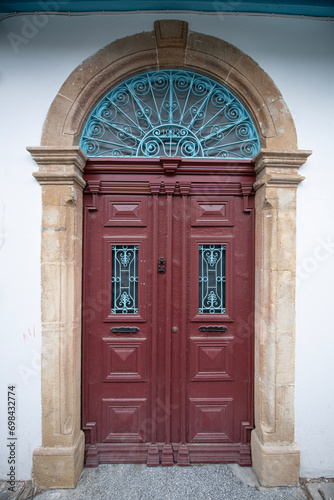 Old historical colorful doors and shutters made of wrought iron and wood. Old historical wooden doors in Cyprus. Doors and shutters of historical stone houses in Nicosia.