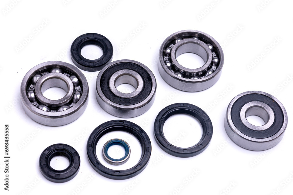 Ball bearings and rubber seals on a white background Ball bearings and rubber seals on a white background