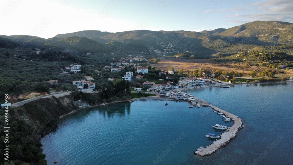 Aerial view of the tranquil sea and green hills with a town on the shore. Zakynthos, Keri