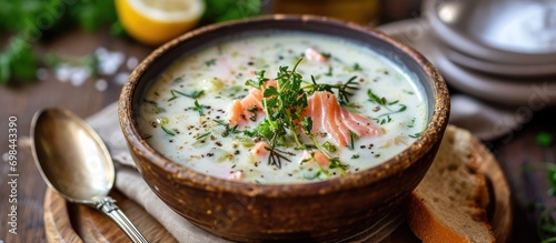 Creamy soup made with fresh salmon and leeks. photo