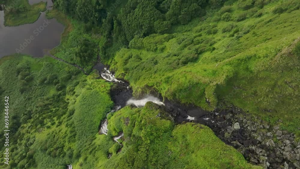 Top down view of Poço Ribeira do Ferreiro waterfall at Flores Azores - Drone shot
