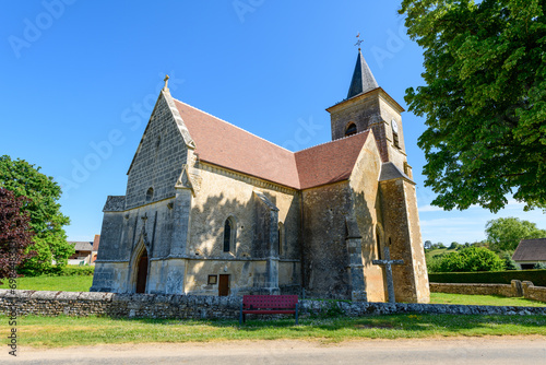 The Saint Martin church in Europe, in France, in Burgundy, in Nievre, in Cuncy les Varzy, towards Clamecy, in Spring, on a sunny day. photo